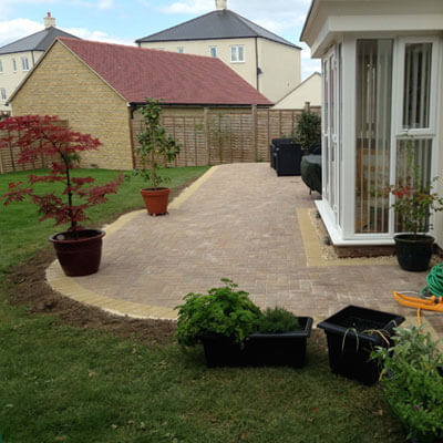 patio leading out to gloucestershire garden